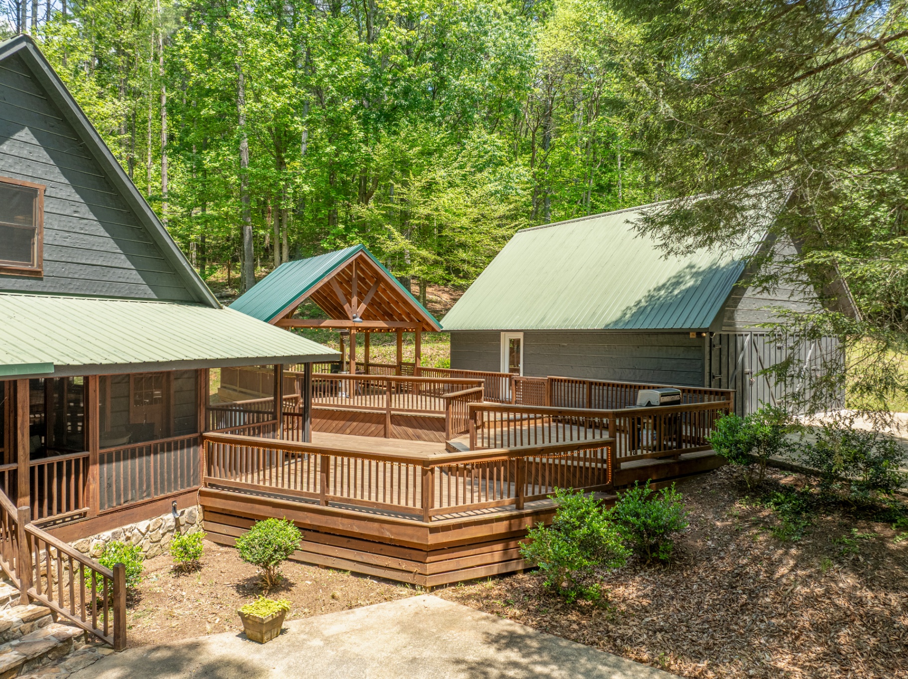 Multi-level back deck with hot tub area and covered pavilion