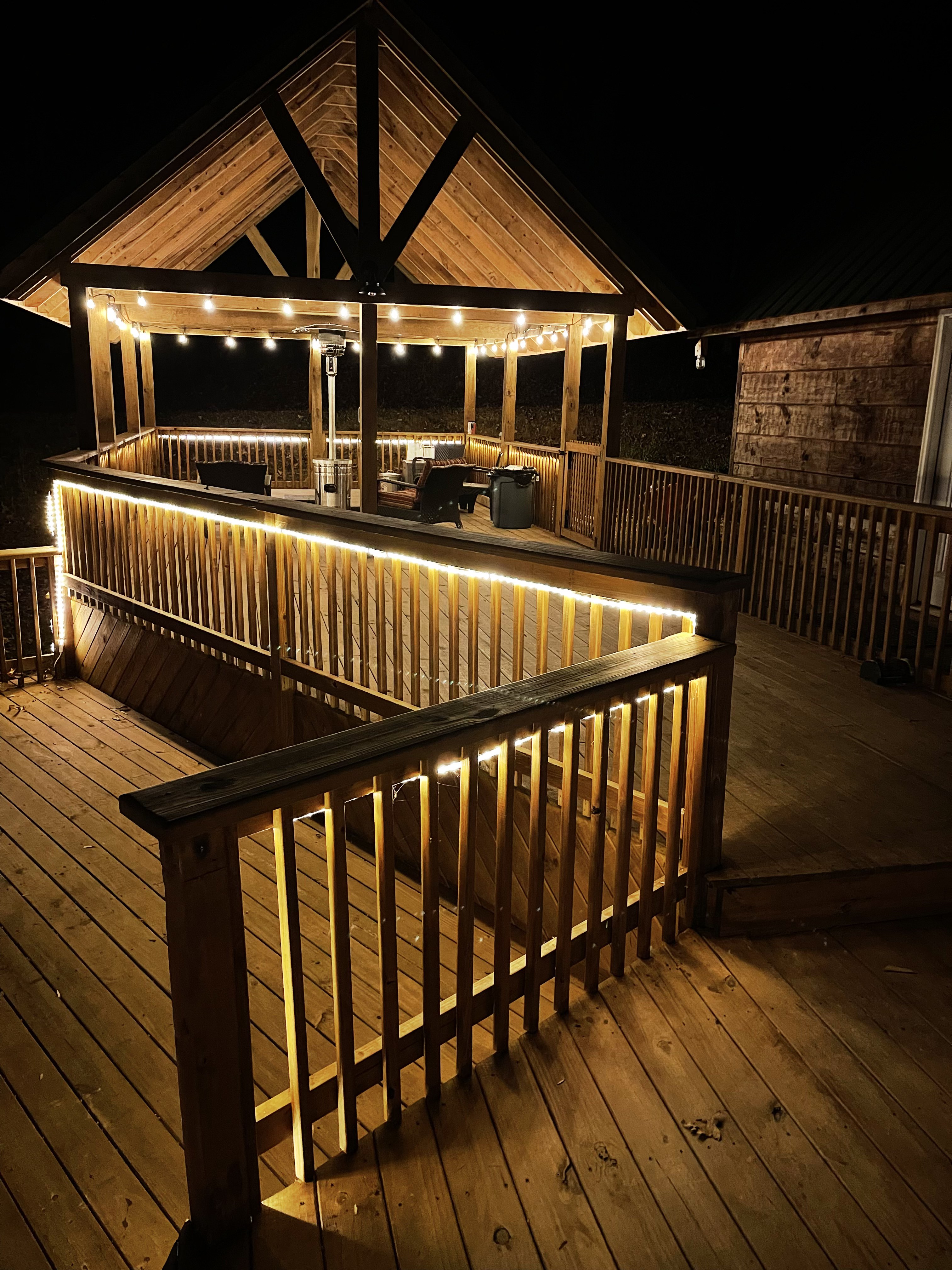 Back deck stairs and railings at night